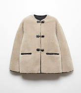 Faux fur coat with applications