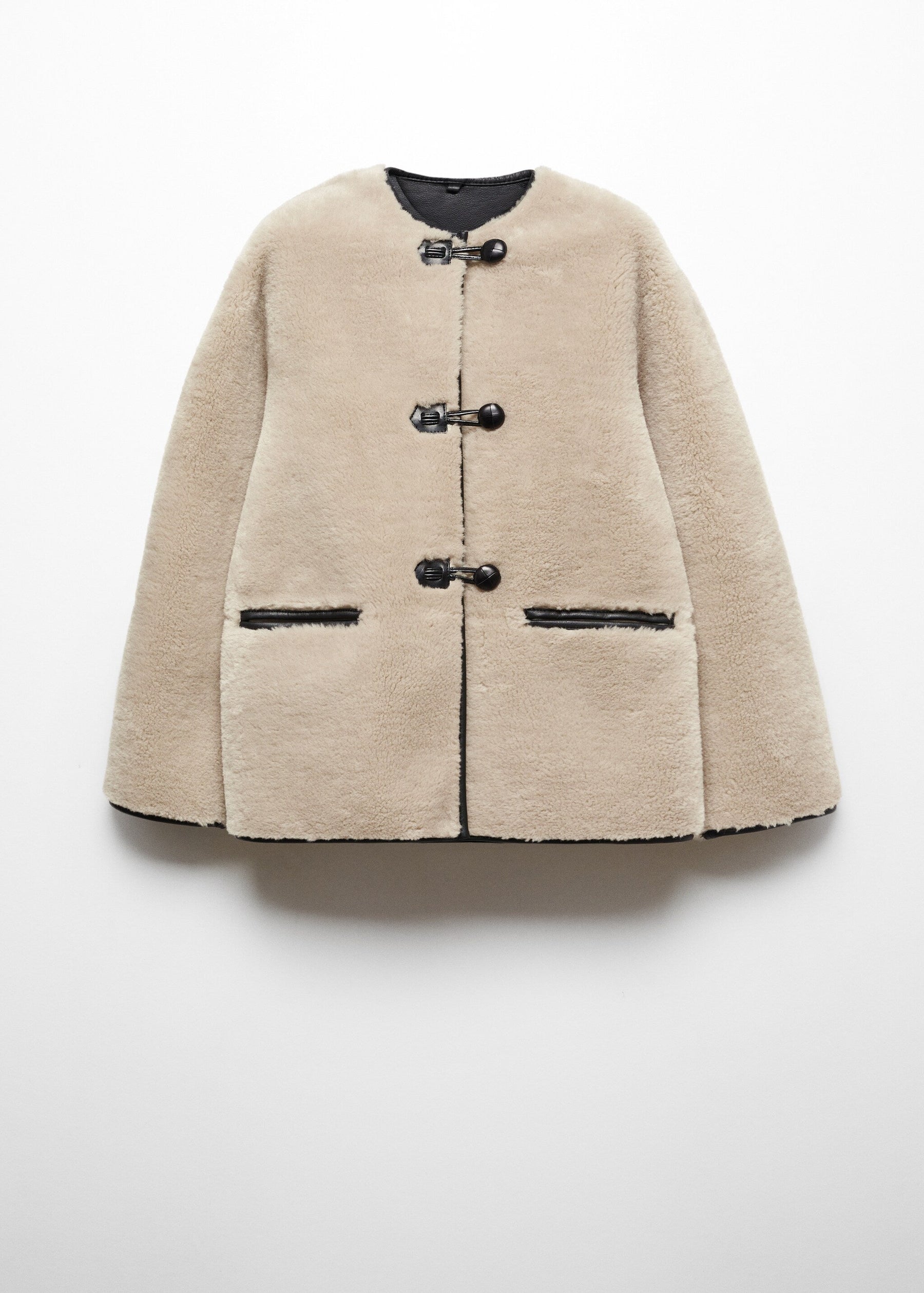 Faux fur coat with applications